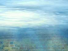 underwater angle on a brick wall, above is brightly lit surface